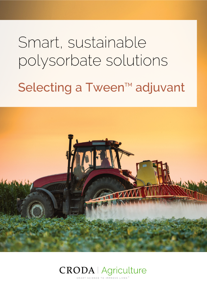 Tractor spraying pesticides on vegetable field with sprayer